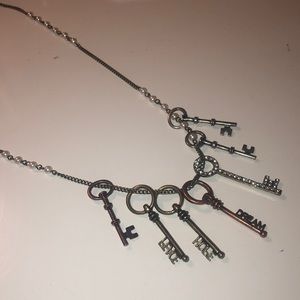 Pearl necklace with multiple key charms